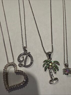 Silver toned crystal Pendant Necklaces, set of 4